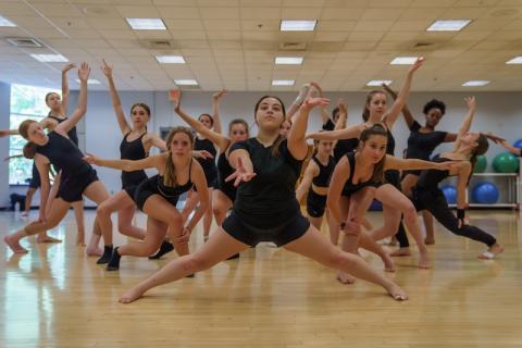 Children participating in a choreographed dance